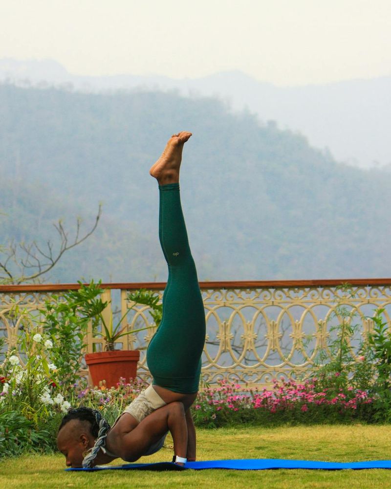 Woman practicing yoga outdoors in Toluca with serene mountains background.